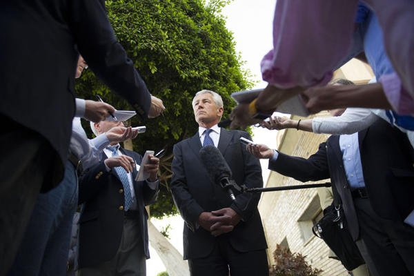 Defense Secretary Chuck Hagel speaks with reporters after leaving Egypt for Abu Dhabi. Hagel said on Thursday that U.S. intlligence now believes Syria has used the sarin gas in its fight against rebels.AP photo
