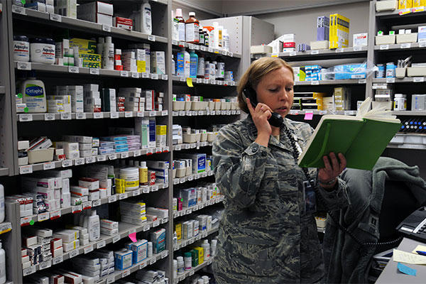 Capt. Christine Cox, 21st Medical Squadron pharmacist and support flight commander, reviews her notes at Schriever Air Force Base, Colorado (U.S. Air Force photo/Staff Sgt. Julius Delos Reyes)