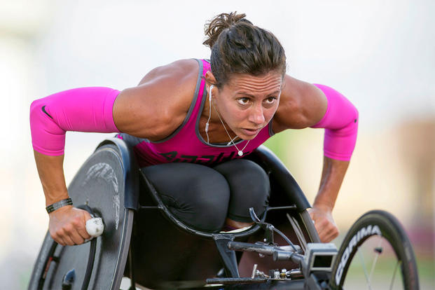 Army Capt. Kelly Elmlinger performs laps in her race wheelchair at Joint Base San Antonio, while training for the 2015 Department of Defense Warrior Games, June 11, 2015. DoD photo by EJ Hersom