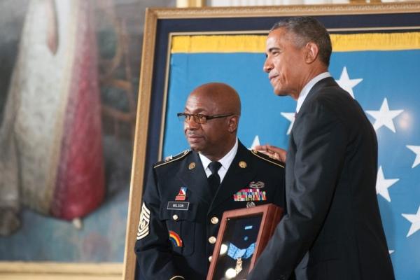 Command Sgt. Maj. Louis Wilson, the top enlisted soldier of the New York Army National Guard, receives the Medal of Honor on behalf of Army Private Henry Johnson. (CARLOS BONGIOANNI/STARS AND STRIPES)