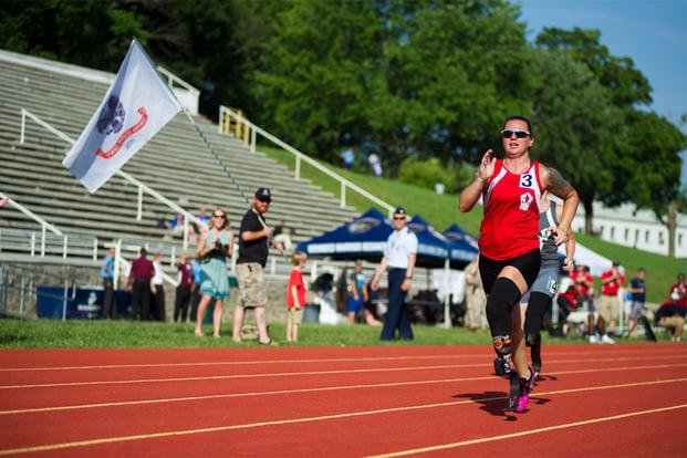 Medically retired Marine Corps Lance Cpl. Sarah Rudder runs the 100-meter sprint during the 2015 Department of Defense Warrior Games at Marine Corps Base Quantico, Va., June 23, 2015. U.S. Marine Corps photo by Lance Cpl. Terry W. Miller Jr.
