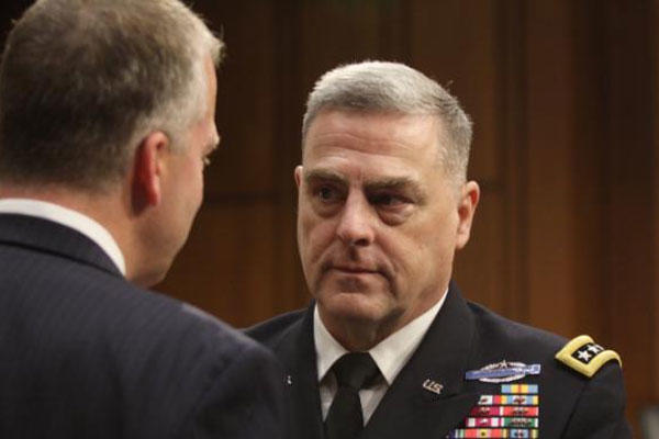 Gen. Mark Milley talks with Sen. Dan Sullivan, R-AK, after Milley's confirmation hearing at the Senate Armed Services Committee on July 21, 2015 on Capitol Hill in Washington. (AP Photo/Lauren Victoria Burke)