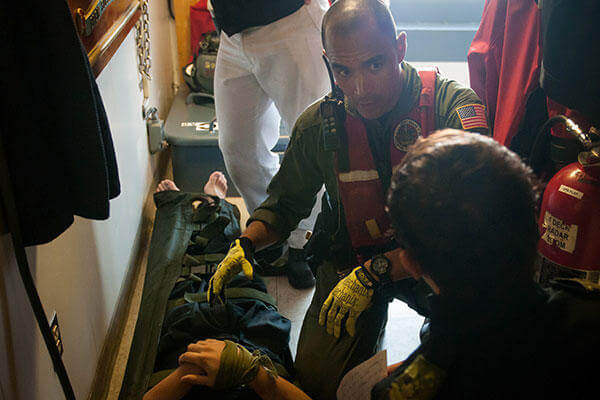 Petty Officer 2nd Class Mario Estevane on board the Canadian Warship HMCS Summerside for a mock medical evacuation. ( (U.S. Coast Guard/PO 3rd Class Ross Ruddell)