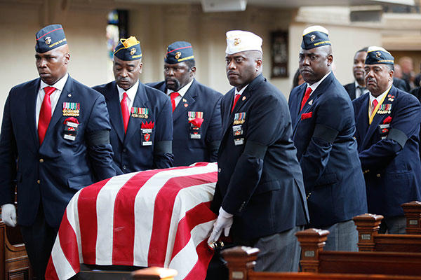 Members of the Montford Point Marine Association carry the casket of Lt. Gen. Frank E. Petersen, Jr. (ret.) during his memorial service. (U.S. Marines/Sgt. Terry Brady)