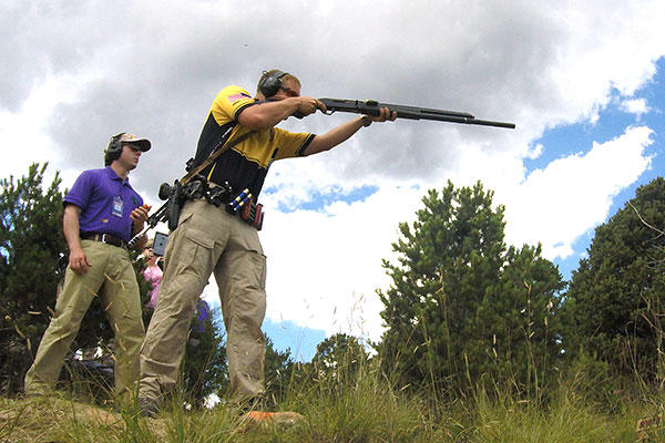 Sgt. Joel Turner fires at a target during the 2015 Rocky Mountain 3-Gun Championship. (U.S. Army/Brenda Rolin)