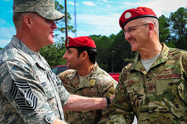 Chief Master Sgt. Bruce Dixon, the 24th Special Operations Squadron command chief, welcomes Chief Master Sgt. of the Air Force James A. Cody during a tour of Hurlburt Field, Fla. (U.S. Air Force/Senior Airman Meagan Schutter) 