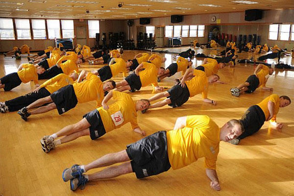 Sailors conduct a group warm-up exercise during the Command Fitness Leader (CFL) course at Naval Air Station Whidbey Island. (U.S. Navy photo)