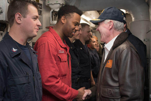 Secretary of the Navy Ray Mabusgreets Sailors assigned to the guided-missile destroyer USS William P. Lawrence before eating lunch with them on the ship's mess decks. (Photo: Mass Communication Specialist 2nd Class Armando Gonzales)