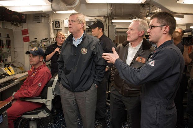 Secretary of the Navy Ray Mabus, center right, and Secretary of Agriculture Tom Vilsack, center left, tour the guided-missile destroyer USS William P. Lawrence. (Photo: Mass Communication Specialist 2nd Class Armando Gonzales)