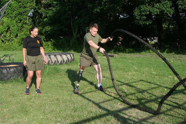 Master Sgt. Berle Sigman, a student in the Faculty Advisors Course at the Quantico Staff Non-Commissioned Officer Academy, completes a physical training session with Master Gunnery Sgt. Amber Hecht, a lead instructor in the FAC. (Courtesy photo)