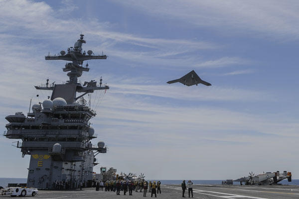 The X-47B launches from a carrier.