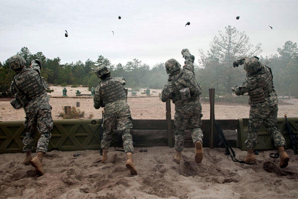 U.S. Sailors toss training grenades during Army Warrior training at Fort Dix, N.J., May 2, 2011. (DoD photo by Mass Communication Specialist 3rd Class Jonathan David Chandler, U.S. Navy/Released)