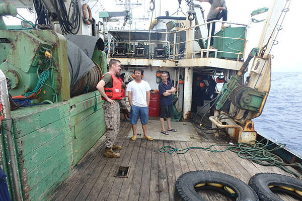 A USCGC Kukui (WLB 203) boarding team, with a shiprider from the Republic of the Marshall Islands, conducts an enforcement boarding of the fishing vessel Lomato in the Pacific Ocean Aug. 29, 2015. (U.S. Coast Guard photo)