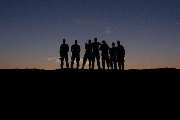 soldiers on hill in sunset