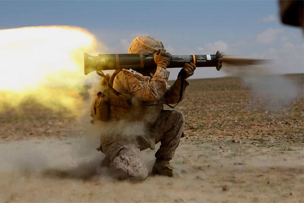 A Marine fires an AT4 antitank rocket at a simulated enemy position in the Central Command's area of operations in Iraq last March. (US Marine Corps/Will Perkins)