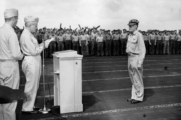 Adm. William Halsey presenting Vice Adm. John McCain with the Navy Cross on the flight deck of USS Hancock, Nov. 30, 1944. (National Museum of Naval Aviation photo)