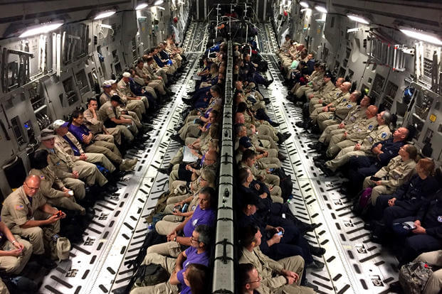 Healthcare professionals travel to Orlando, Fla. on board an Air Force C-17 Globemaster III, in response to a government request to assist with Hurricane Irma disaster response operations. (US Air Force photo/Ryan DeCamp)