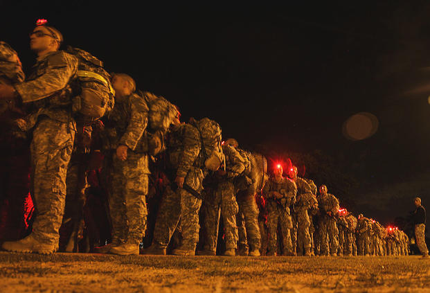 U.S. Army Soldiers conduct a 12-mile foot march during the Ranger Course on Fort Benning, GA., April 23, 2015. Soldiers attend the Ranger Course to learn additional skills in a physically demanding environment. (U.S. Army /Pfc Antonio Lewis/Released)