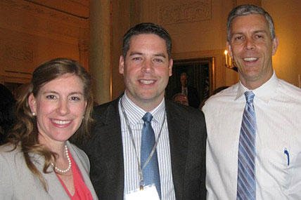 Angela Wilson, a Defense Department teacher in Vicenza, Italy, poses with her husband, Chase, and U.S. Education Secretary Arne Duncan during National Teacher of the Year events April 23, 2012, in Washington, D.C. Wilson was among four finalists.