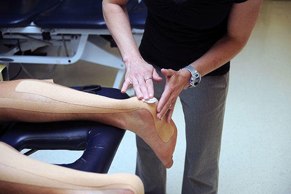 Angelique Ruiz, a physical therapist at the Officer Candidates School branch clinic, performs a therapeutic treatment. (U.S. Marine Corps/Lance Cpl. Tabitha Bartley)