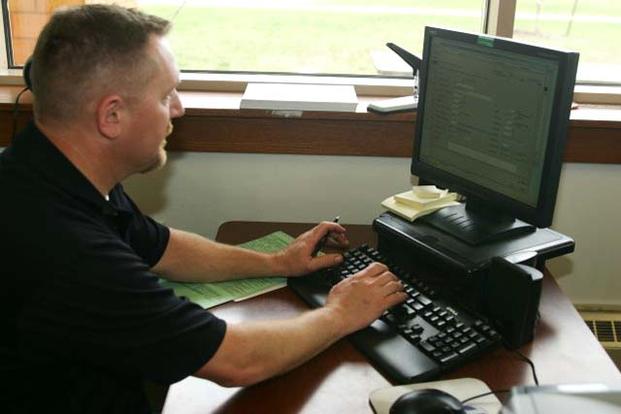 Soldier works on a computer. (Photo: Army.mil)