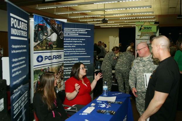 FILE -- Soldiers talk with employers during the Hiring Our Heroes job fair at Fort McCoy, Wis. Hundreds of service members, veterans and prospective employers attended the event. (Army Photo/Scott T. Sturkol)
