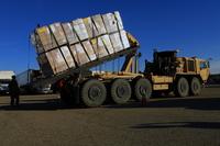 FILE PHOTO -- U.S. Army National Guard Soldiers load pallets of food onto a palletized loading system Thurs., Dec. 7, 2017, at Joint Forces Training Base Los Alamitos, California. (U.S. Air National Guard/Senior Airman Crystal Housman)