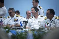 July 25: Chief of Naval Operations Adm. John Richardson (with headphones) participates in the 28th Inter-American Naval Conference in Cartagena, Colombia. (US Navy photo/Elliott Fabrizio)