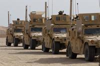 Soldiers line up their Humvees before a vehicle gunnery exercise at Camp Buehring, Kuwait, on Nov. 16, 2015. The U.S. Army’s Mobile Protected Firepower system, coming online in 2025, will provide enhanced firepower capable of destroying hardened targets. (U.S. Army/Sgt. Youtoy Martin)