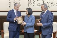 Taiwan's President Tsai Ing-wen, center exchange gifts with U.S. Rep. Mario Diaz-Balart, R-Fla., left and Rep. Ami Bera, D-Calif