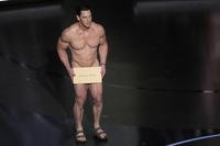 Fifty years after a male streaker ran across the stage at the Academy Awards, a nude John Cena presents the award for best costume design during the Oscars on Sunday, March 10, 2024, at the Dolby Theatre in Los Angeles.