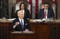 President Joe Biden holds a Laken Riley Botton as delivers the State of the Union address