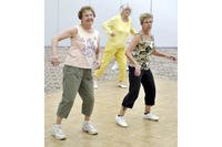 From left, Joan Targonski, Barbara Gilly and Tootie Herman dance in a Zumba class, a fitness program inspired by Latin dance, at the Enfield Senior Center in Enfield, Conn.