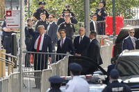 Former President Donald Trump arrives at Manhattan criminal court with his legal team