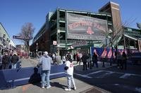 Fans outside Fenway Park before an opening-day baseball game