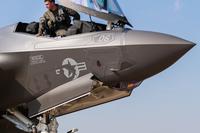A pilot assigned to the 2nd Marine Aircraft Wing, Marine Corps Air Station Cherry Point, N.C., prepares to climb out of the cockpit of an F-35C Lightning II, Sept. 16, 2025. A three-ship of Marine F-35Cs landed at Vance Air Force Base, Okla., for a fuel stop. (U.S. Air Force photo by 2nd Lt. Connor Brezenski)