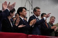 U.S. Defense Secretary Pete Hegseth, center right, with Japanese Prime Minister Sanae Takaichi, left, and Defense Minister Shinjiro Koizumi, gestures as they listen to President Donald Trump speak to members of the military aboard the USS George Washington, an aircraft carrier docked at an American naval base, in Yokosuka, south of Tokyo, Tuesday, Oct. 28, 2025. (AP Photo/Mark Schiefelbein) Japan Trump Asia