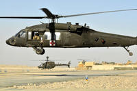An Army HH-60 Black Hawk MEDEVAC helicopter from C Company, 3rd Battalion, 25th Aviation Regiment, 25th CAB heads off for another mission on Kandahar Airfield, Afghanistan.