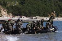 U.S. and Republic of Korea Marines launch an inflatable boat off the coast of Baengnyeongdo, Republic of Korea, during Korean Marine Exchange Program 15-13, Sept. 7, 2015. Photo By: Lance Cpl. Steven Tran