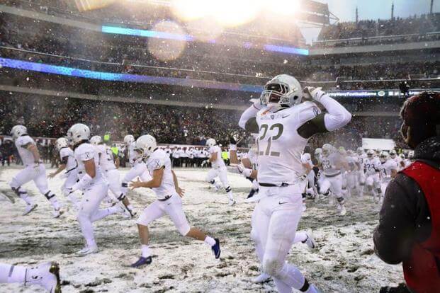 Army defensive back Ke'Shaun Wells flexes as he runs onto the field before the 118th Army-Navy Game, Dec. 9, 2017, at Lincoln Financial Field in Philadelphia.  (Photo by Steve Whitman/Military.com)