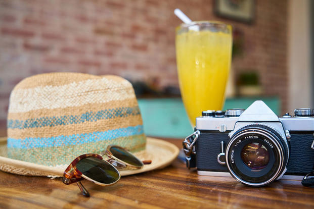 tropical drink, beach hat, camera, vacation