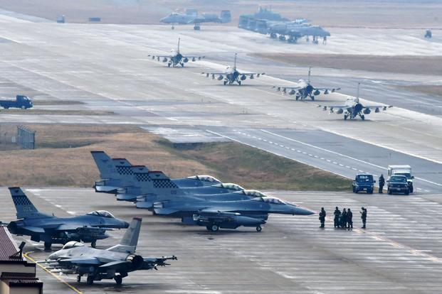 U.S. Air Force F-16 Fighting Falcon fighter aircraft, assigned to the 36th Fighter Squadron, participate in an elephant walk during Exercise VIGILANT ACE 18 at Osan Air Base, Republic of Korea, Dec. 3, 2017. (U.S. Air Force photo/Franklin R. Ramos)