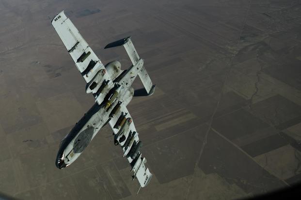 A U.S. Air Force A-10 Thunderbolt II departs to continue a mission after receiving fuel from a KC-135 Stratotanker assigned to the 447th Air Expeditionary Group over Syria, Dec. 1, 2017. (U.S. Air Force/Staff Sgt. Paul Labbe)