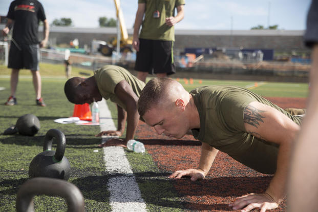 Marines perform burpees.