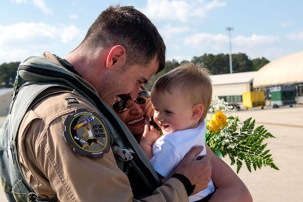  captain from the 336th Fighter Squadron greets his family after returning from deployment, April 11, 2018, at Seymour Johnson Air Force Base, North Carolina. Airmen from the 336th FS returned from a deployment in support of Operation Inherent Resolve. (U.S. Air Force/Shawna L. Keyes)