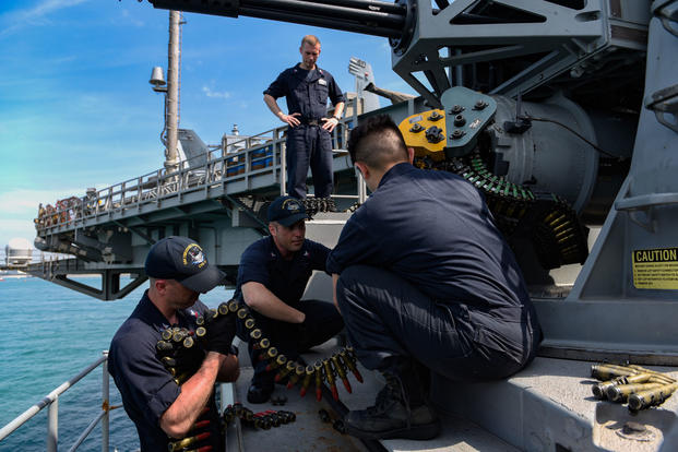 Sailors load a close-in weapon system aboard the aircraft carrier USS Theodore Roosevelt, April 6, 2018. (U.S. Navy photo/Andrew Langholf)