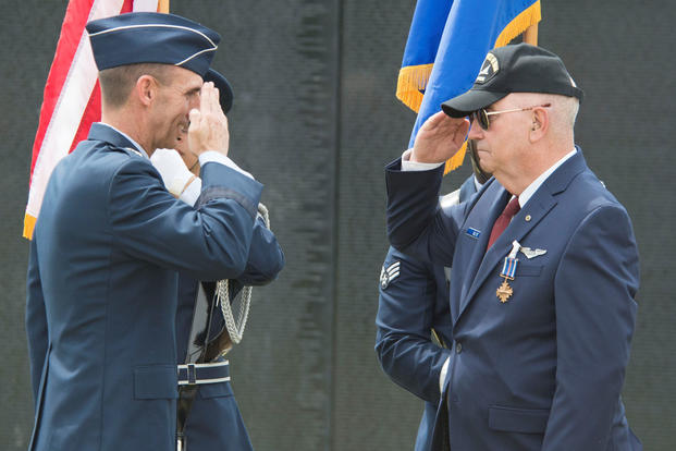 U.S. Air Force Maj. Gen. Scott Zobrist, 9th Air Force commander, returns a salute from retired Capt. Johnny Blye at The Wall That Heals in Camden, S.C., May 5, 2018. Blye received the Distinguished Flying Cross. (U.S. Air Force photo/Benjamin Ingold)