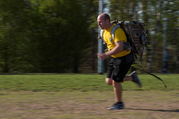 An airman runs during a challenge obstacle course on Ramstein Air Base in Germany.
