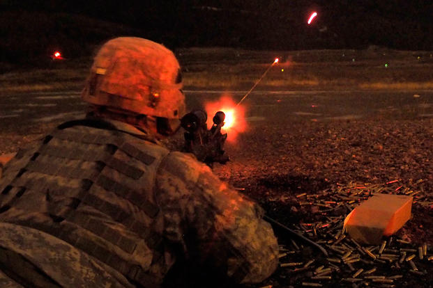 Army Pfc. Aaron Hadley assigned to Apache Company, 1st Battalion (Airborne), 501st Infantry Regiment, 4th Infantry Brigade Combat Team (Airborne), 25th Infantry Division, U.S. Army Alaska, qualifies at night with the M240 machine gun on Grezelka range at Joint Base Elmendorf-Richardson, Alaska (Photo: U.S. Air Force/Justin Connaher)