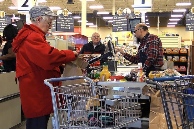 Customers bag groceries at Peterson Air Force Base, Colorado. (U.S. Air Force/Joshua Arends)